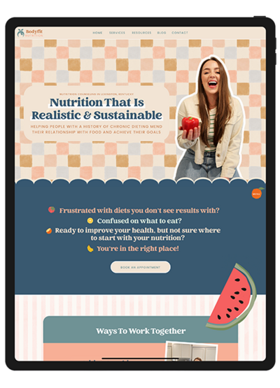 Mockup of a nutrition website template showcasing vibrant food graphics and sections for articles on healthy eating and recipes.