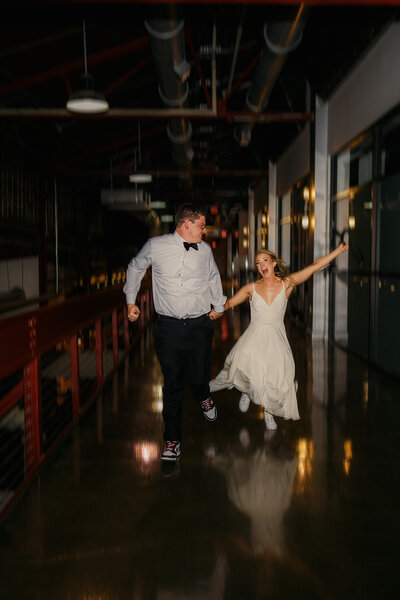 Bride and groom running back to their reception at The Factory in Franklin TN 