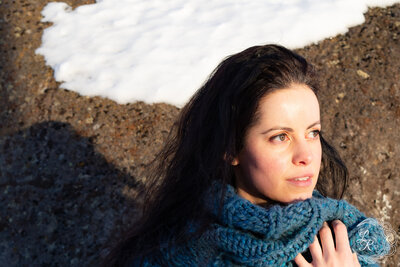 headshot of Lela in a grove of aspen trees under golden light
