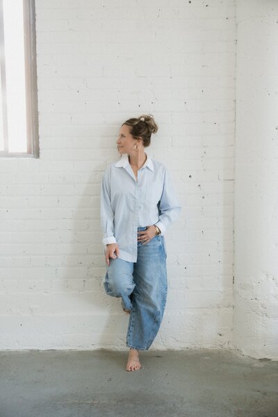 Empowered perimenopause and menopause coach embracing strength, balance, and natural wellness practices