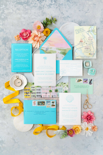 Elegant Charleston wedding invitation suite with blue and yellow accents, featuring an illustrated map and letterpress invitations