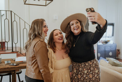 women posing laughing