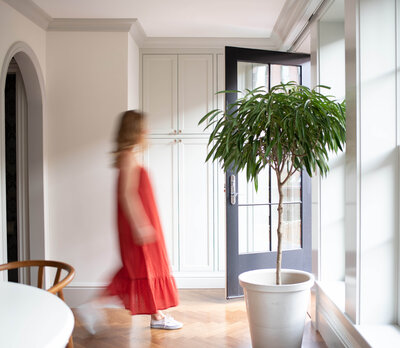 Boston designer Sarah Scales creates a durable, stylish family space with mid-century elements, custom furniture, and contemporary art in a classic brownstone.