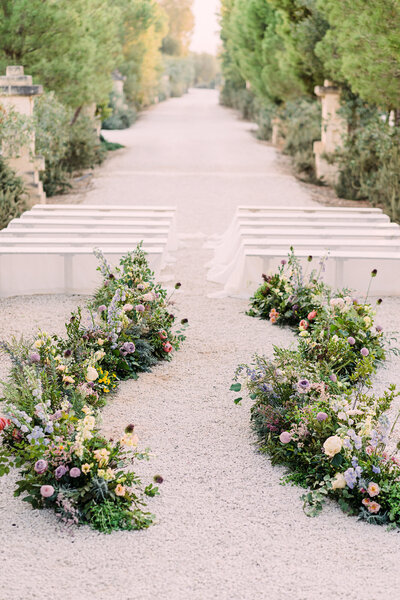 outdoor Italy wedding ceremony with floral aisle