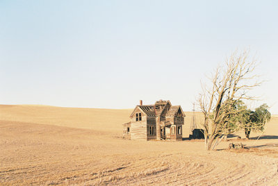 Old farm house in a barren field