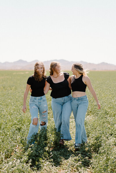 Logan Jade Photo senior rep team walking in a grassy field