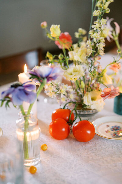 Florals designs with cherry red tomatoes by Jessamine Floral and events, New Jersey floral designer