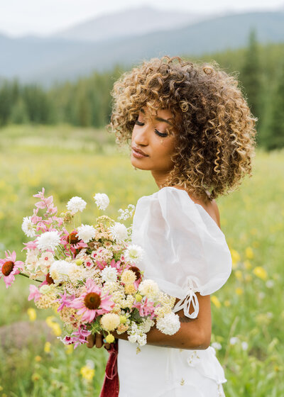 bride in a wildflower field in Breckenridge Colorado