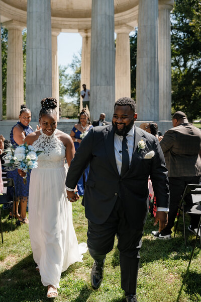 A couple holding hands and walking