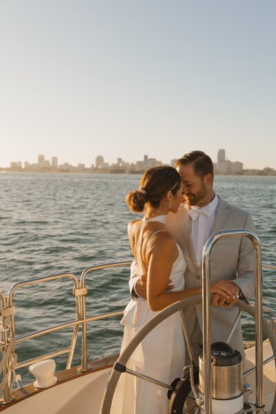 couple embraces on sail boat in arizona