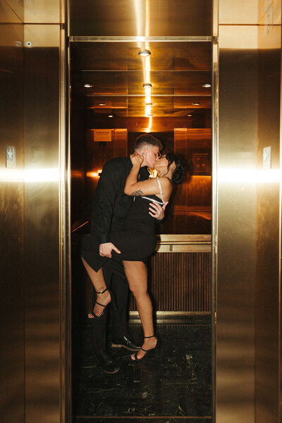 couple kiss in elevator