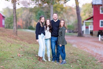 Portrait of a family at Starrs Mill Waterfall in Fayetteville Georgia.