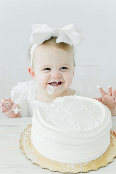 Baby sitting with cake