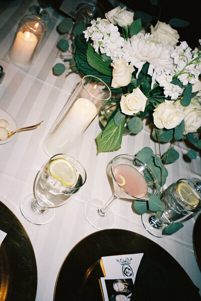 bride is pouring champagne into their champagne tower during their colorado wedding day.