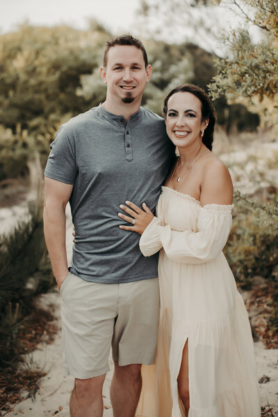 man and woman smiling