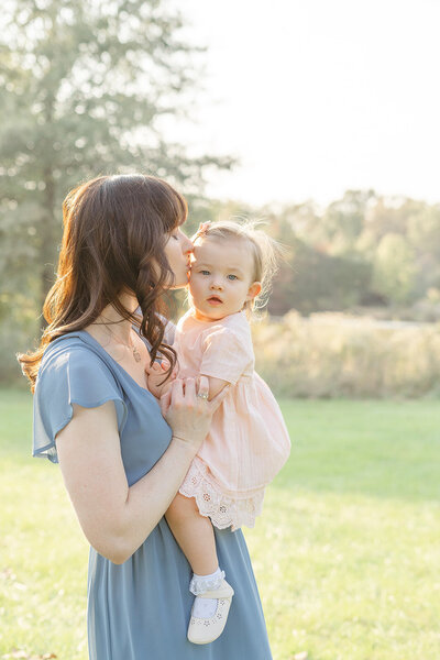 mom kissing daughter during Loudoun County, VA fall mini session