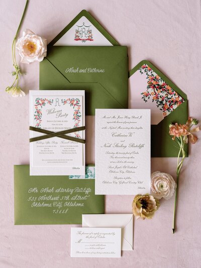 A pink and green wedding bouquet, held by a bride.
