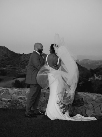 a bride and groom leaving their ceremony at their wedding in Mykonos, Greece