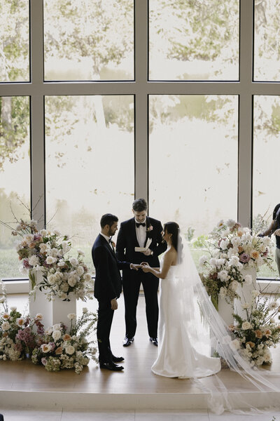 Bride and groom during ceremony at wedding planned by Bianca Nichole and Co