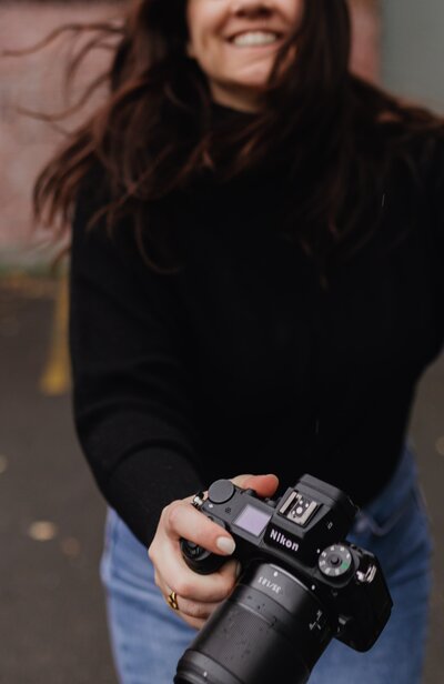 woman holding her camera