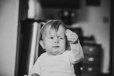 toddler investigating a chip