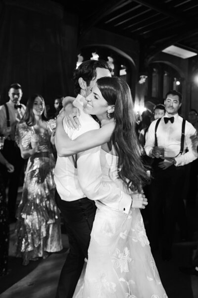 Black and white photo embracing on dance floor