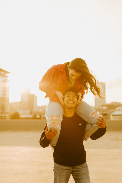 Girl on fiance's shoulders