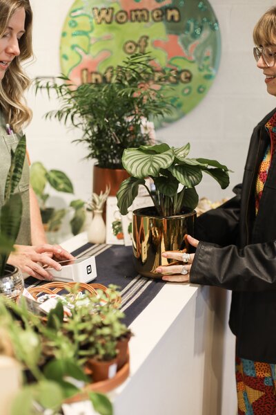 person purchasing plant from House Plant Collective Shop