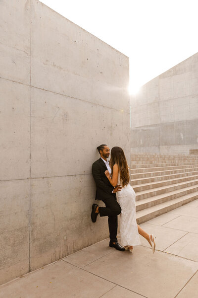 couple embraces for engagement photos in arizona