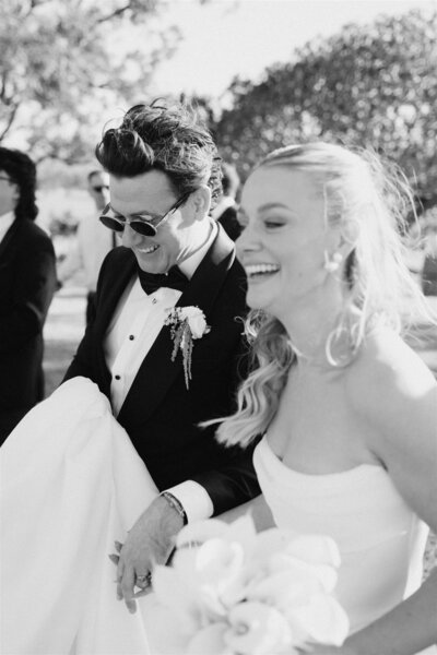 A couple celebrating as they enter the receptionat their hunter valley wedding