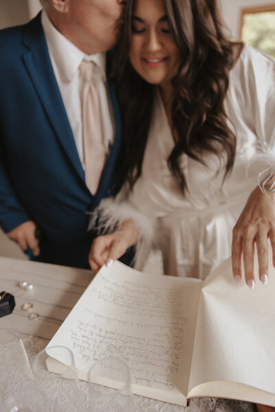 dad and daughter in boulder colorado having special moment before first look with dad. handwritten vows made it extra special.