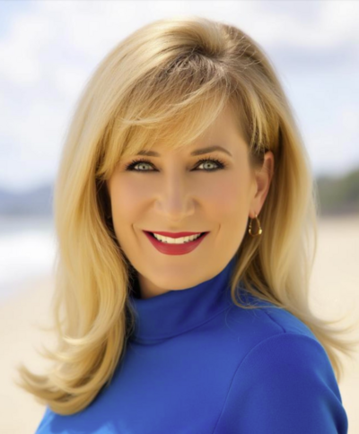 Staff headshot in front of neutral background.