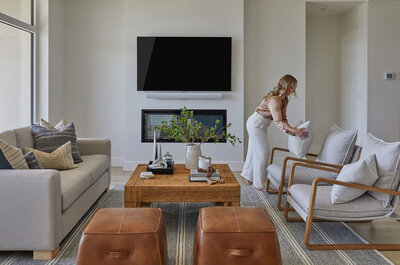 Designer styling a modern-rustic living room