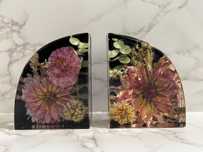 Bookends featuring preserved flowers representing one of the offerings available for flower preservation.
