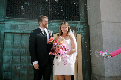 NYC city hall elopement couple exit with bubbles