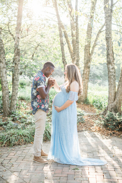 maternity photo taken at golden hour in a park