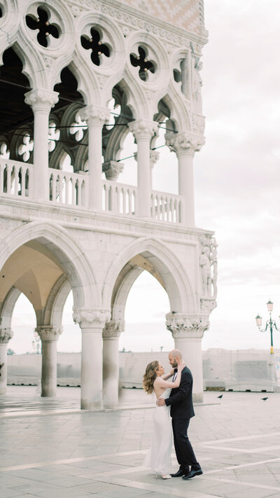 a couple is dancing in the middle of venice dancing so romantically