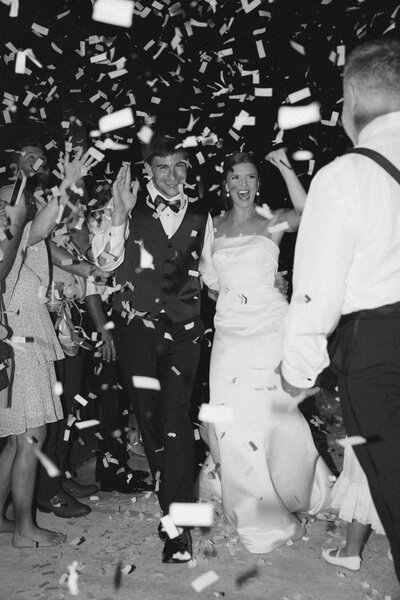Birmingham Alabama film wedding photographer documents couple exiting wedding in Alabama with confetti.