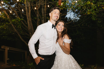 Bride and groom hugging at reception at Abernethy Center in Oregon City, Oregon