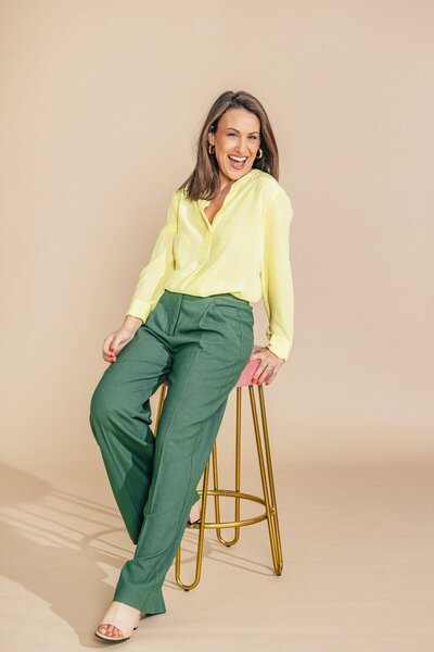Julia Korn in Yellow Blouse Smiling