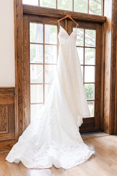 Dress hanging in door at  First Presbyterian Church in Columbus Georgia| Wedding Photographer Amanda Horne