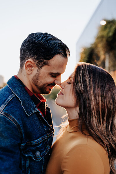 Destination Wedding Photographer captures couple touching noses during engagement photos in Nashville
