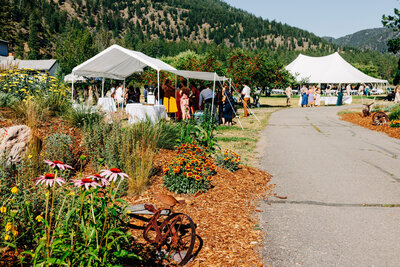 Outdoor wedding reception tents at Blackfoot River House in Bonner, MT