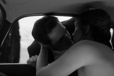 a couple kissing in the car