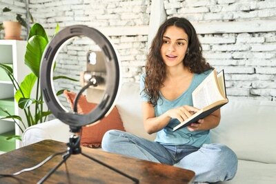 Author reading from book for video content, demonstrating book marketing and promotion services