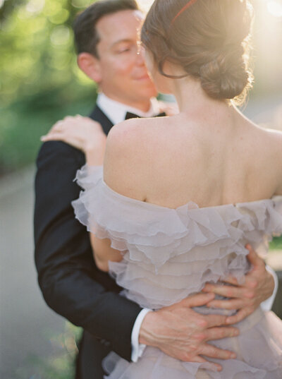 Bride in pink Marchesa and Prade in Central Park by Liz Andolina