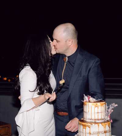 Sunset kiss on the rooftop of the Quirk Hotel, overlooking Richmond with NYC wedding energy.
