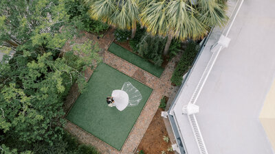 drone photo of a couple at the William Aiken House in Charleston