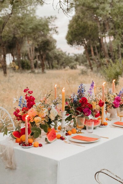 Bright Wedding Flowers and Fruits Wedding Table Decor with Orange Stationery