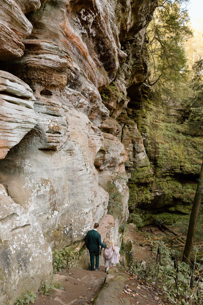 Couple walking down a path at Rock House during their elopement.